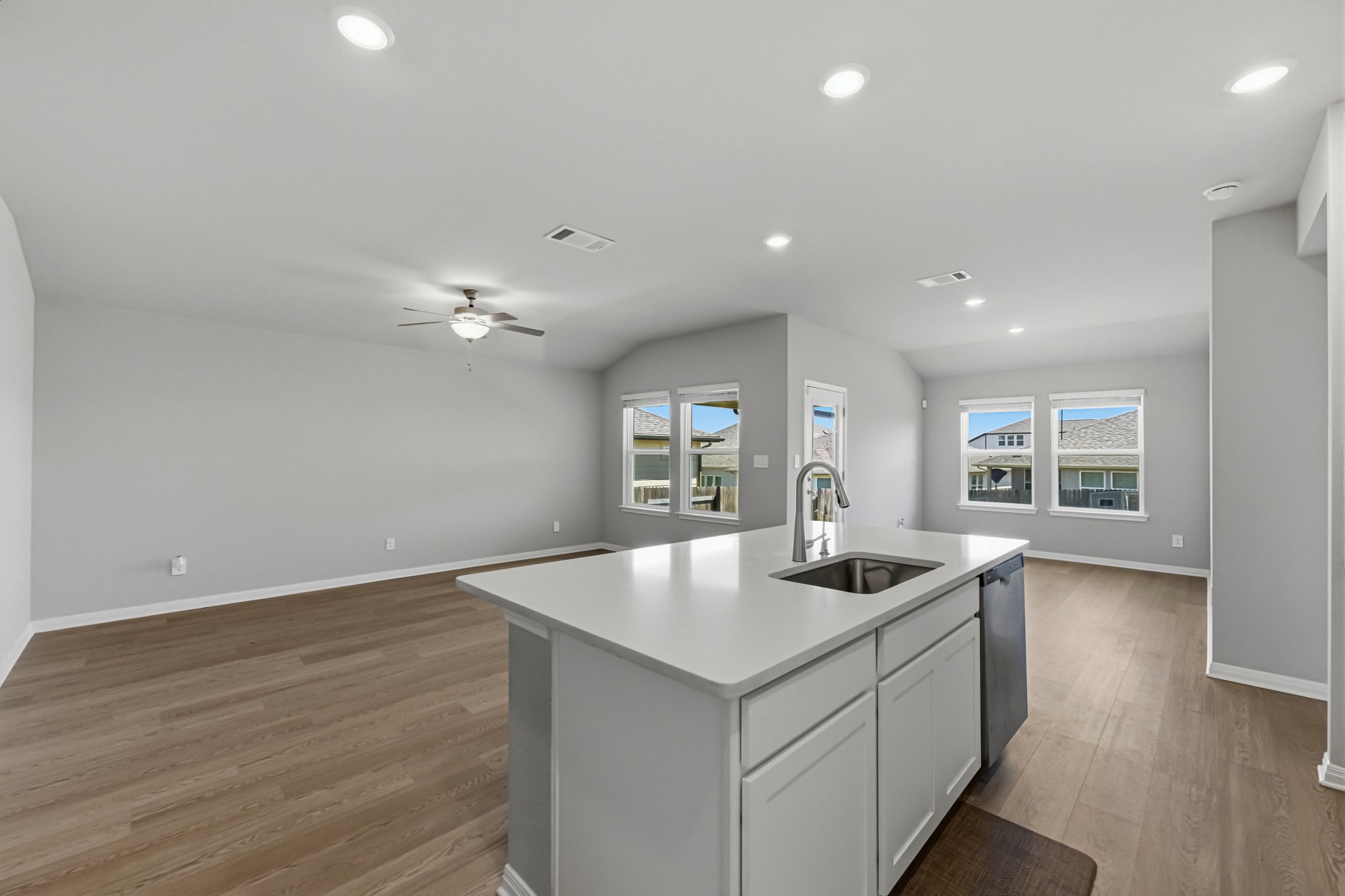 12309 Dairywork Road Buda, TX 78610 - Photo 29 of 29 Kitchen with open floor plan, recessed lighting, an island with sink, light wood-type flooring, and plenty of natural light