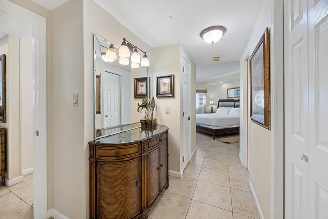 a view of a hallway with living room and furniture