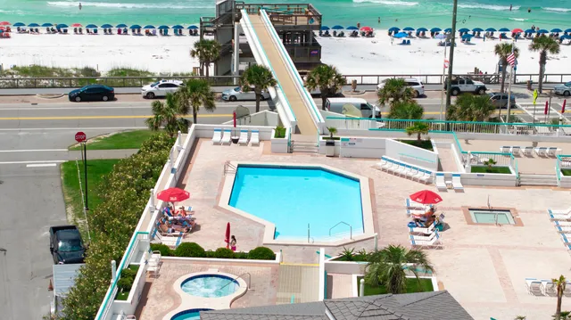 an aerial view of a house with a ocean view
