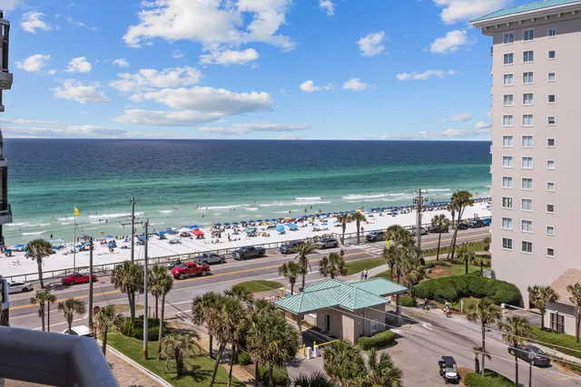 a view of roof deck with city view and ocean view