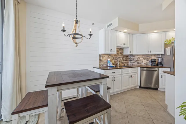 a kitchen with a refrigerator a sink and dishwasher
