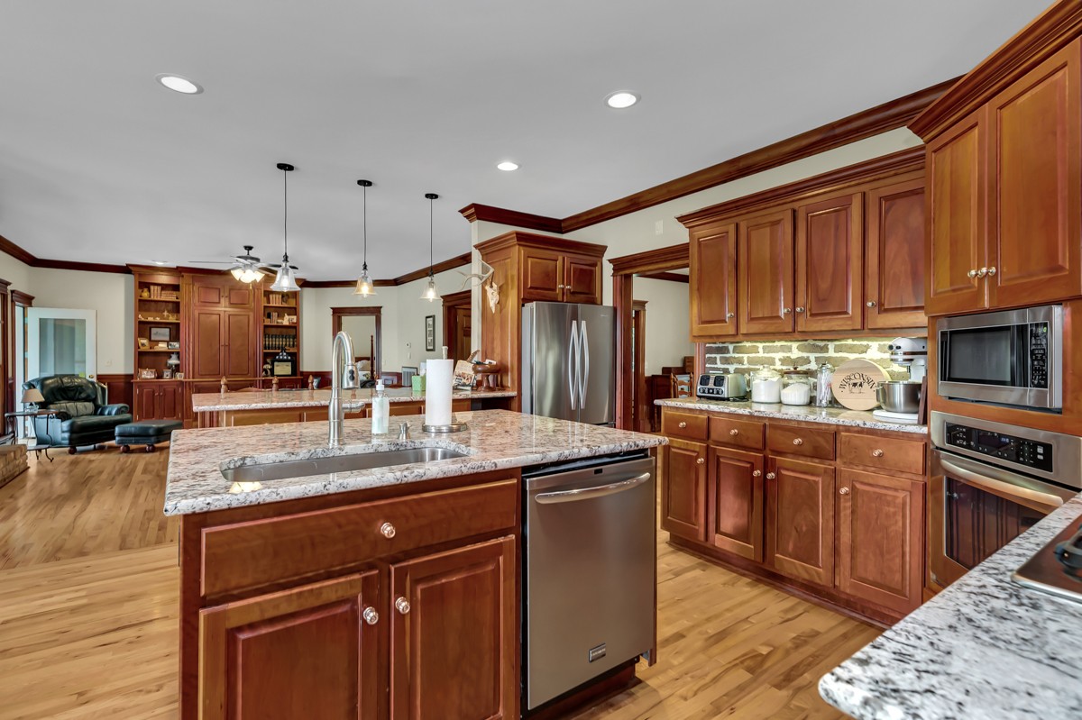 49 Crystal Ridge Road Mulberry, TN 37359 - Photo 8 of 58 a kitchen with stainless steel appliances granite countertop a sink a stove and a refrigerator