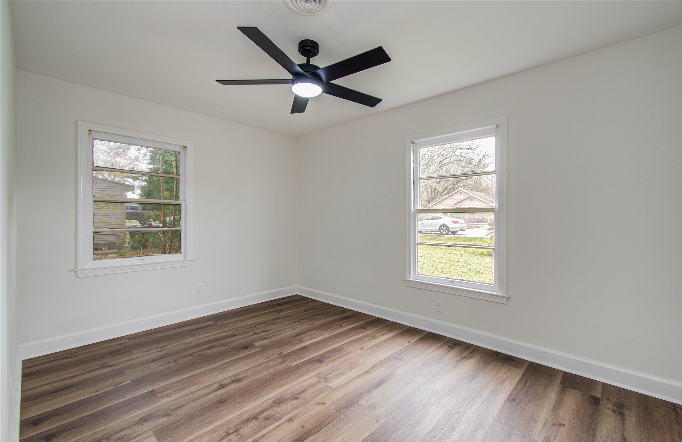 2417 Pecan Street Dickinson, TX 77539 - Photo 36 of 43 a view of a big room with wooden floor and windows