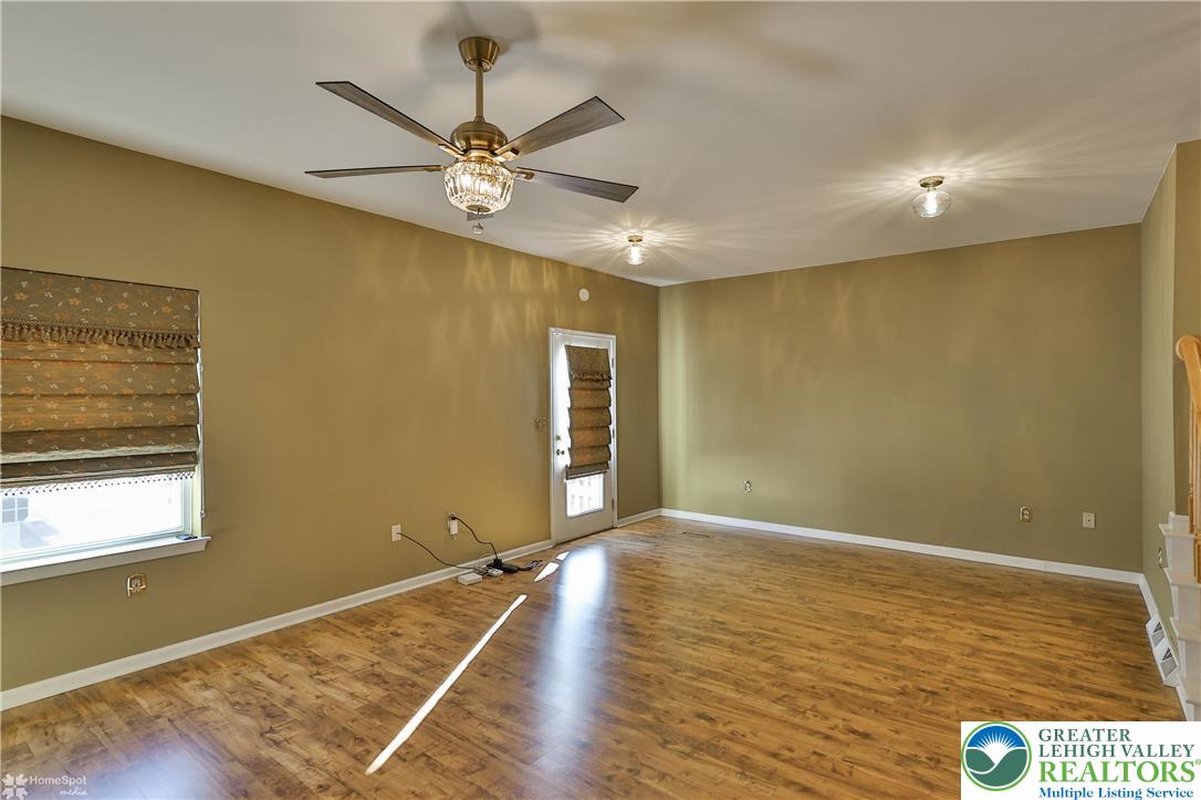 1302 Adams Street Northampton, PA 18067 - Photo 12 of 57 a view of an empty room with wooden floor and a window