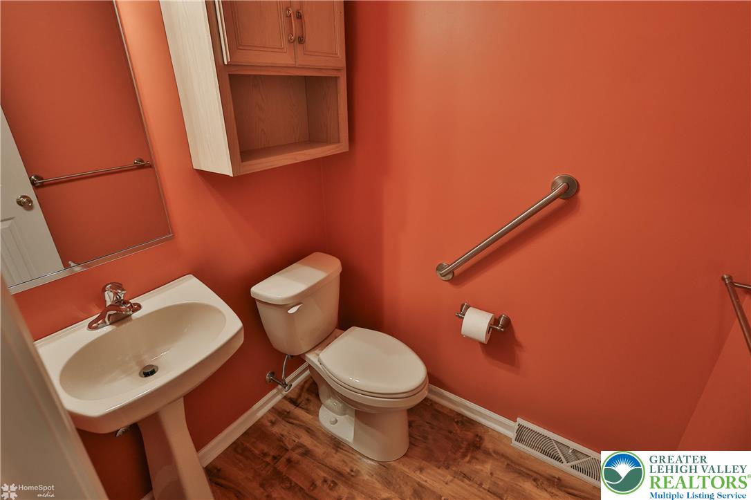 1302 Adams Street Northampton, PA 18067 - Photo 18 of 57 a bathroom with a toilet a sink and mirror