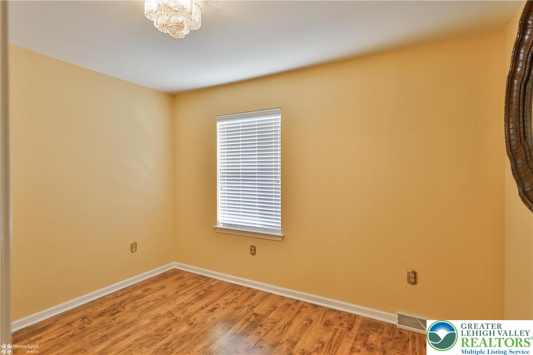 1302 Adams Street Northampton, PA 18067 - Photo 23 of 57 a view of an empty room with wooden floor and a window