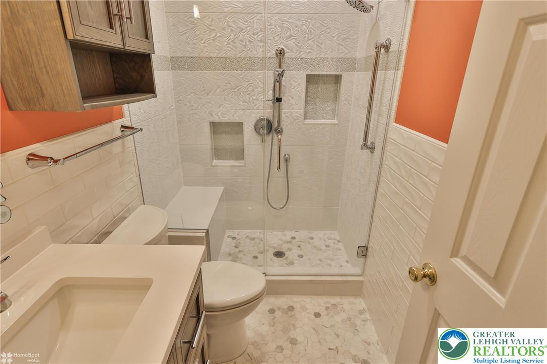 1302 Adams Street Northampton, PA 18067 - Photo 27 of 57 a bathroom with a toilet sink and shower