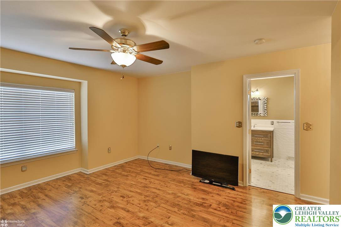 1302 Adams Street Northampton, PA 18067 - Photo 30 of 57 a view of a livingroom with wooden floor and a ceiling fan