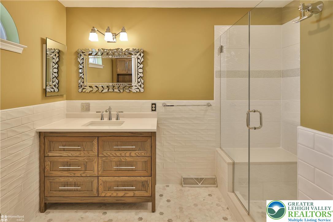 1302 Adams Street Northampton, PA 18067 - Photo 33 of 57 a bathroom with a sink a vanity and a mirror