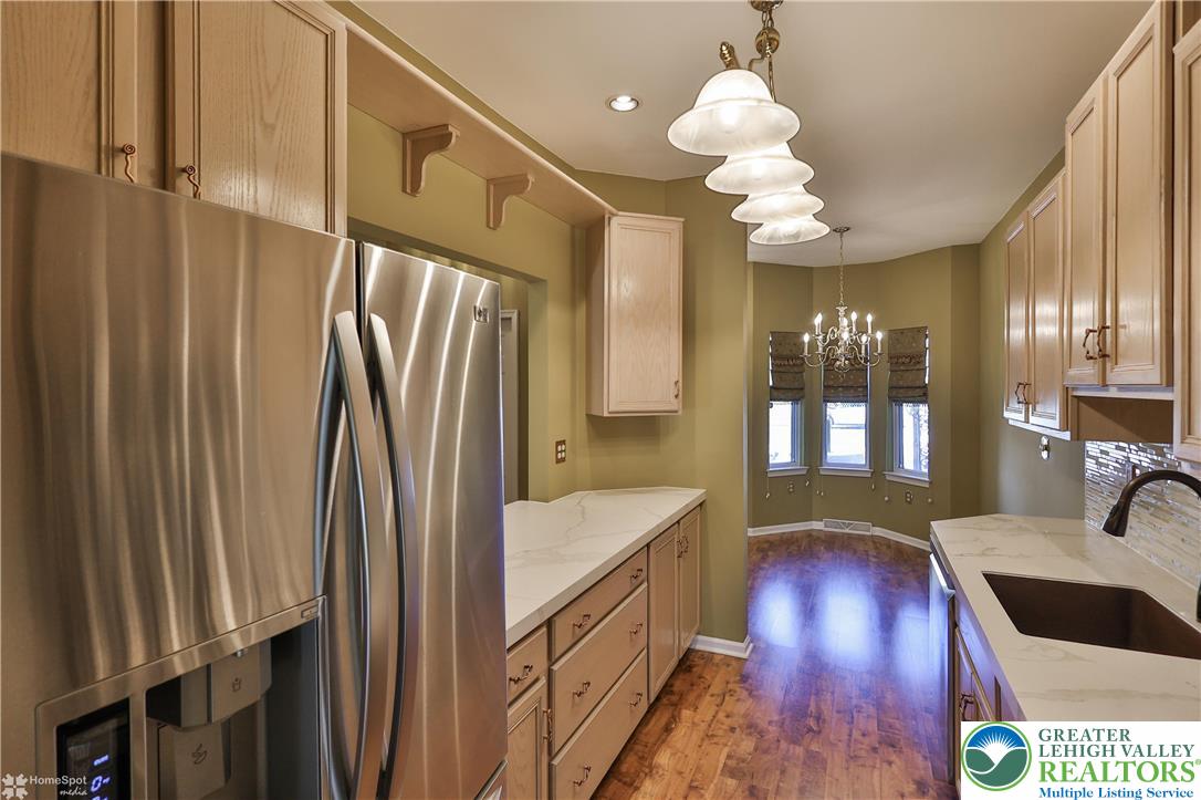 1302 Adams Street Northampton, PA 18067 - Photo 10 of 57 a bathroom with a sink a large mirror and a bathtub
