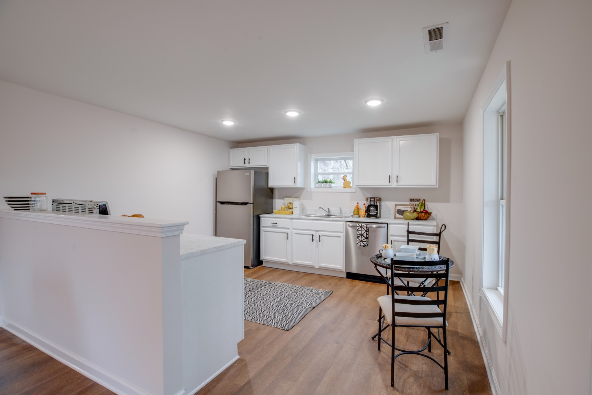 324 Cowan Road Dickson, TN 37055 - Photo 2 of 18 a kitchen with stainless steel appliances a refrigerator and a stove top oven