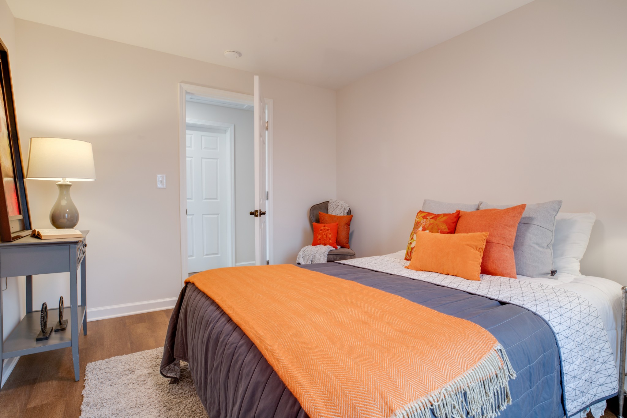 324 Cowan Road Dickson, TN 37055 - Photo 10 of 18 a bedroom with a bed and wooden floor