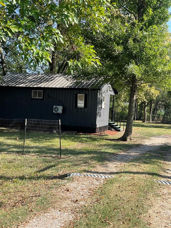311 Southwest 6th Street Kerens, TX 75144 - Photo 11 of 24 a view of a house with a yard