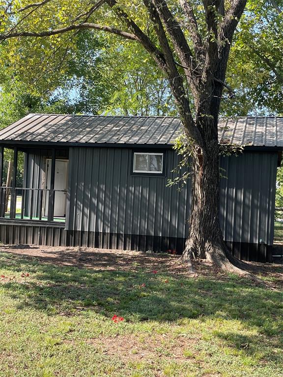 311 Southwest 6th Street Kerens, TX 75144 - Photo 12 of 24 a view of a house with a yard