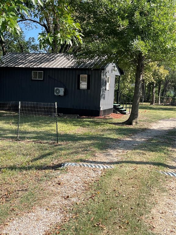 311 Southwest 6th Street Kerens, TX 75144 - Photo 8 of 24 a backyard of a house