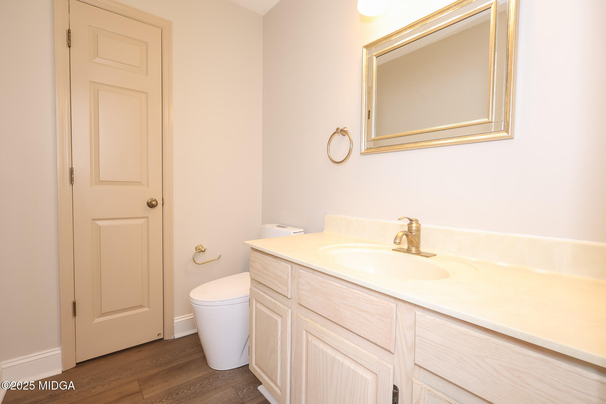 111 Bunkers Trail Warner Robins, GA 31088 - Photo 17 of 31 a bathroom with a granite countertop sink a toilet and a mirror