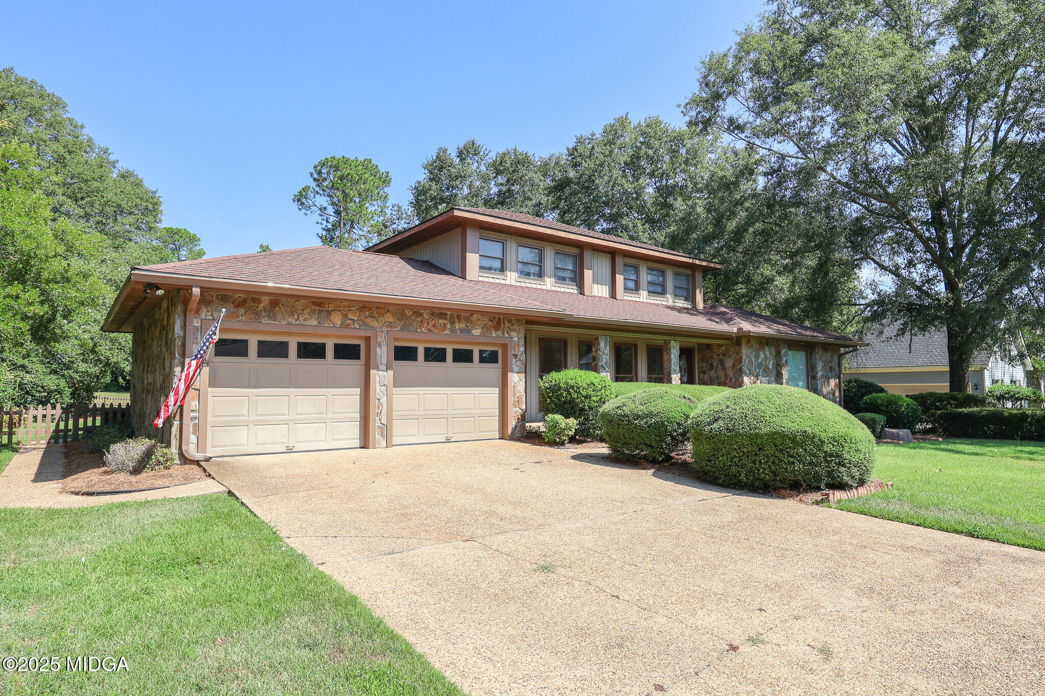 111 Bunkers Trail Warner Robins, GA 31088 - Photo 2 of 31 a front view of a house with a garden and yard