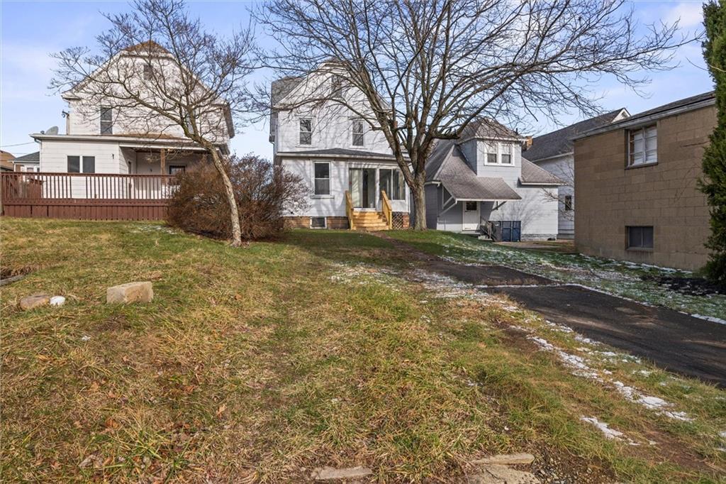 325 Walnut Street Vandergrift, PA 15690 - Photo 27 of 29 a view of a yard with a house in the background