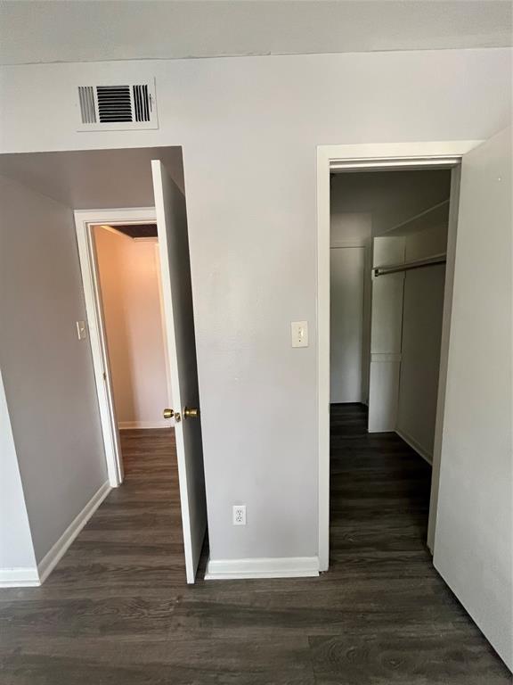 7000 Creswell Road, Unit 223 Shreveport, LA 71106 - Photo 13 of 16 a view of a hallway view with wooden floor and staircase