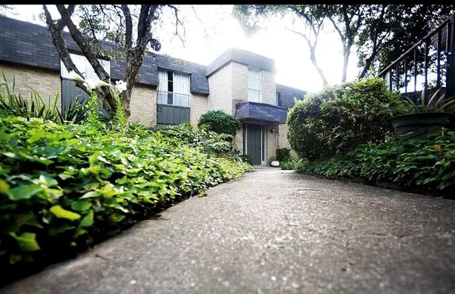 a view of a swimming pool with outdoor seating