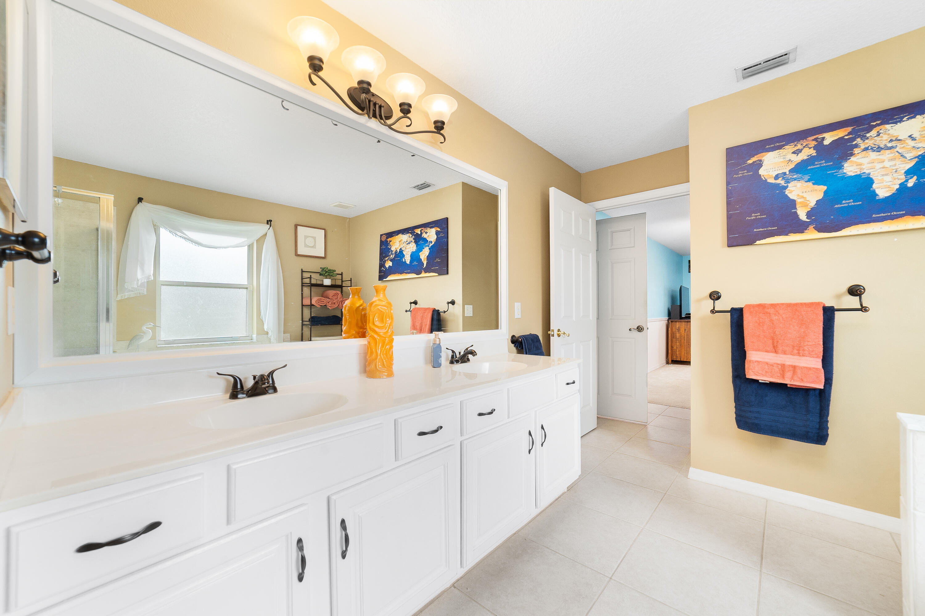 4292 Southwest Whitebread Road Port St. Lucie, FL 34953 - Photo 14 of 28 a bathroom with a double vanity sink mirror and