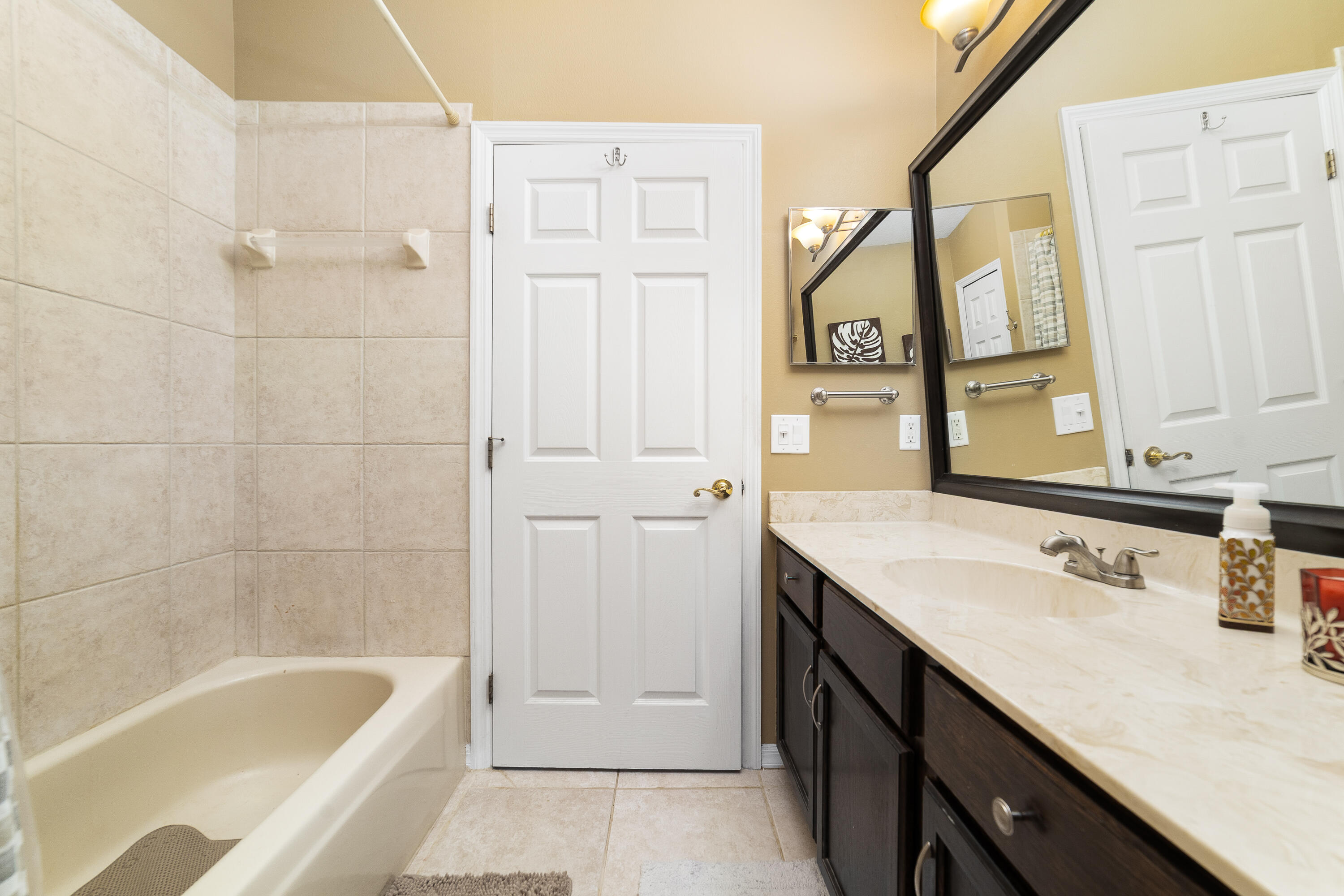 4292 Southwest Whitebread Road Port St. Lucie, FL 34953 - Photo 16 of 28 a bathroom with a tub sink and mirror