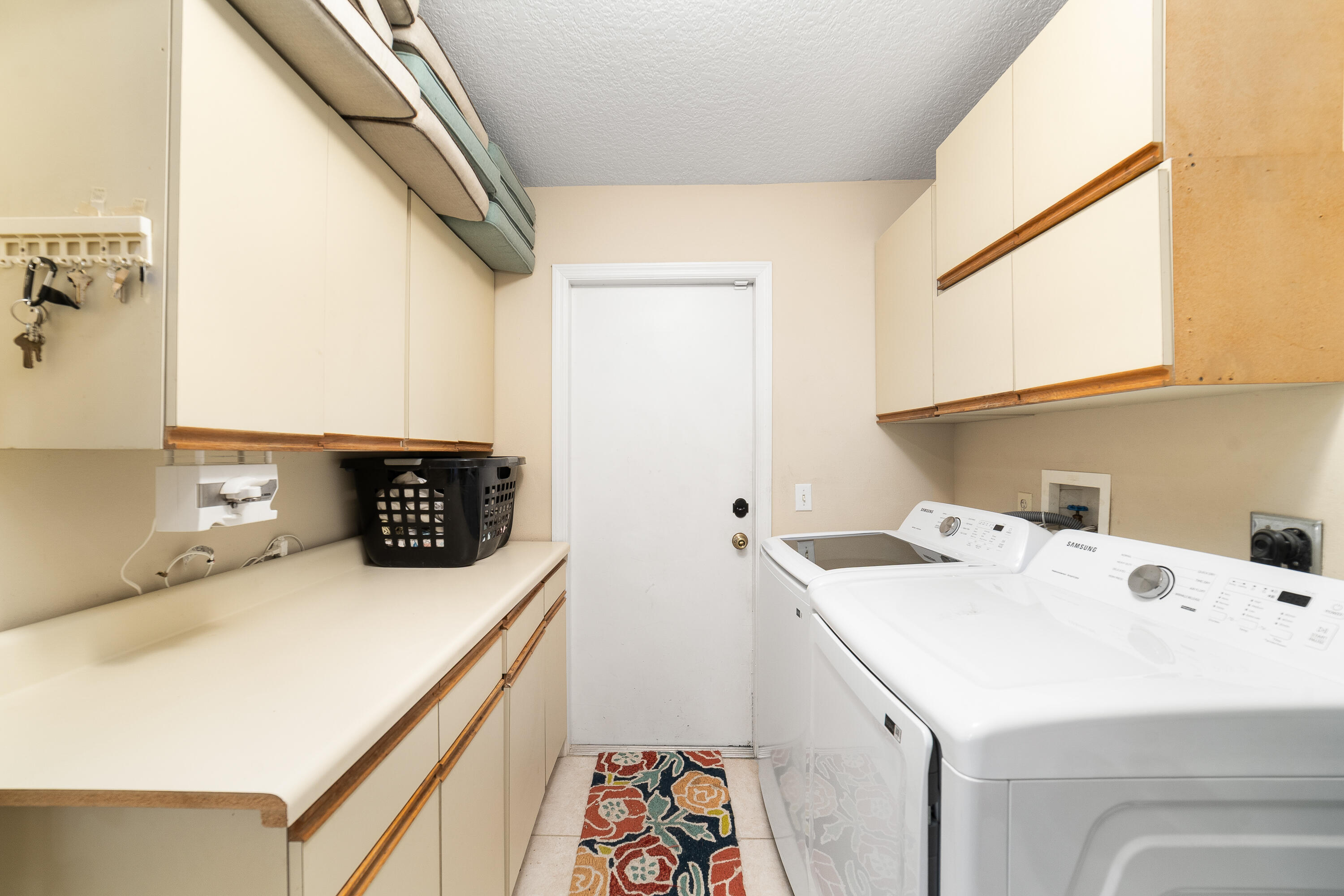 4292 Southwest Whitebread Road Port St. Lucie, FL 34953 - Photo 18 of 28 a utility room with dryer and washer