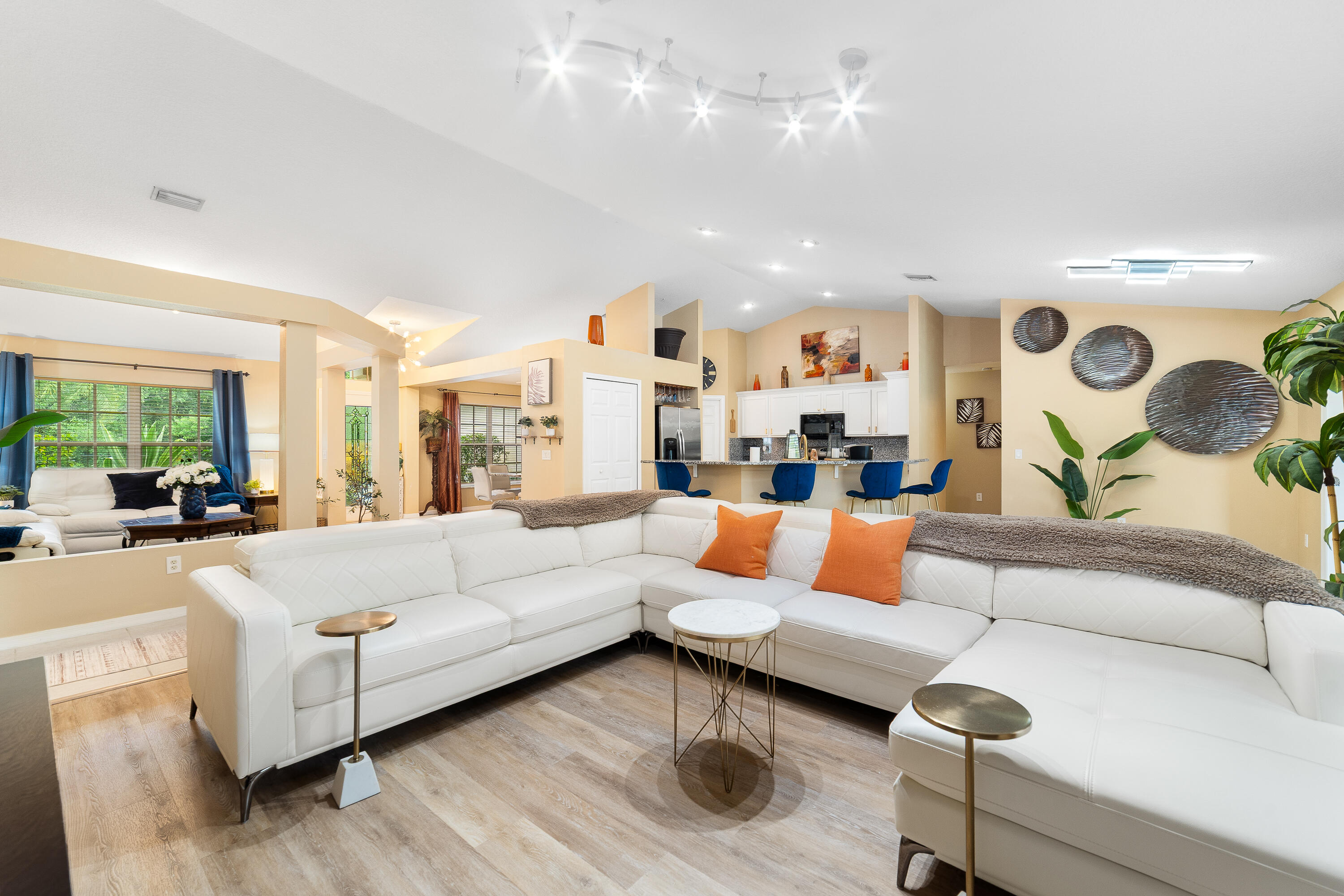 4292 Southwest Whitebread Road Port St. Lucie, FL 34953 - Photo 8 of 28 a living room with furniture and kitchen view