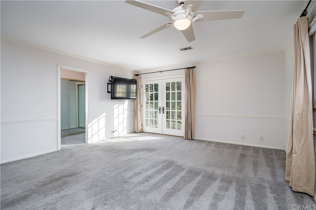 12513 Carinthia Drive Whittier, CA 90601 - Photo 17 of 35 an empty room with chandelier fan