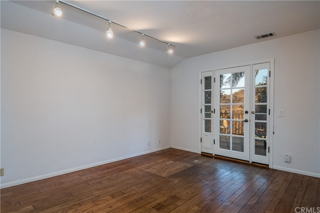 12513 Carinthia Drive Whittier, CA 90601 - Photo 20 of 35 wooden floor in an empty room with a window