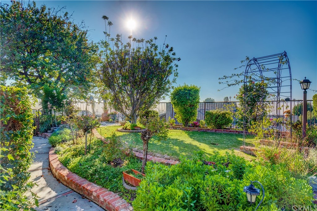 12513 Carinthia Drive Whittier, CA 90601 - Photo 28 of 35 a view of a garden with a fountain