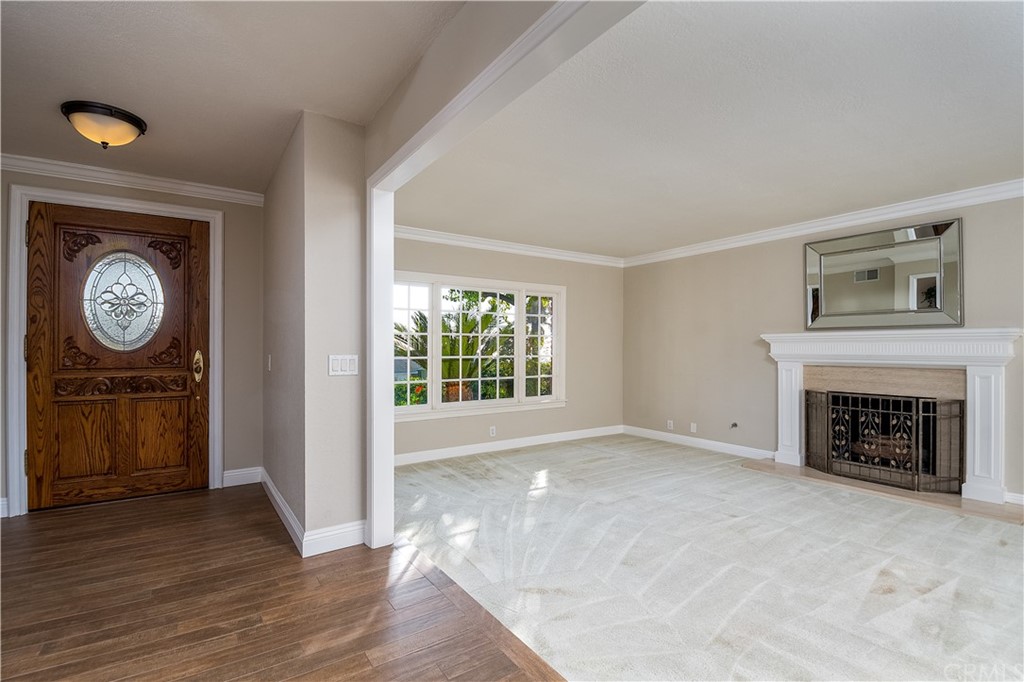 12513 Carinthia Drive Whittier, CA 90601 - Photo 4 of 35 a view of a livingroom with a fireplace and a window