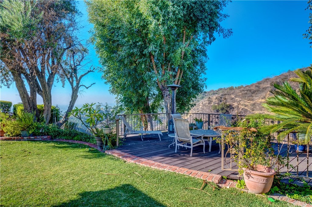 12513 Carinthia Drive Whittier, CA 90601 - Photo 35 of 35 a view of outdoor dining space with a patio and plants