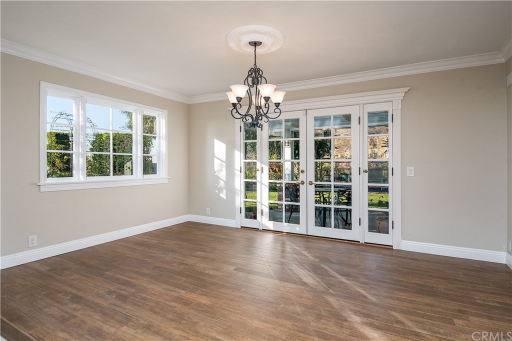 12513 Carinthia Drive Whittier, CA 90601 - Photo 7 of 35 a view of an empty room with wooden floor and windows