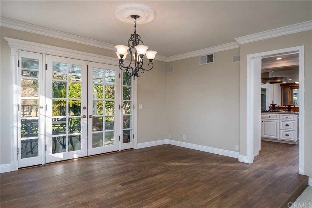 12513 Carinthia Drive Whittier, CA 90601 - Photo 8 of 35 a view of a livingroom with wooden floor and a chandelier