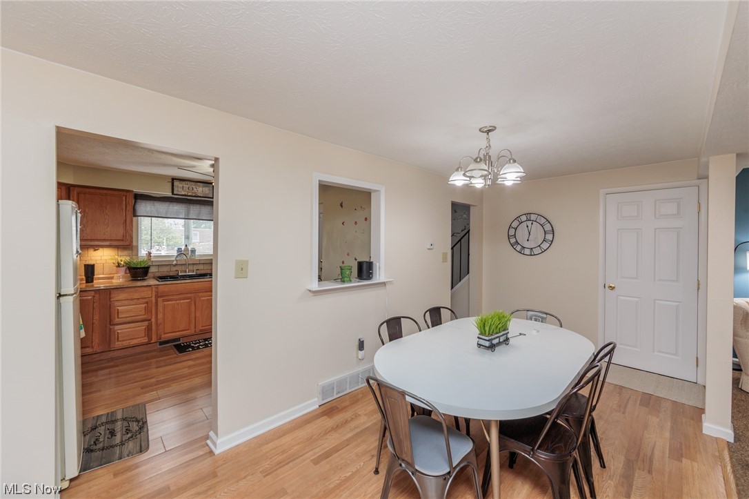 6476 State Road, Unit H8 Cleveland, OH 44134 - Photo 14 of 35 Dining room with light hardwood flooring