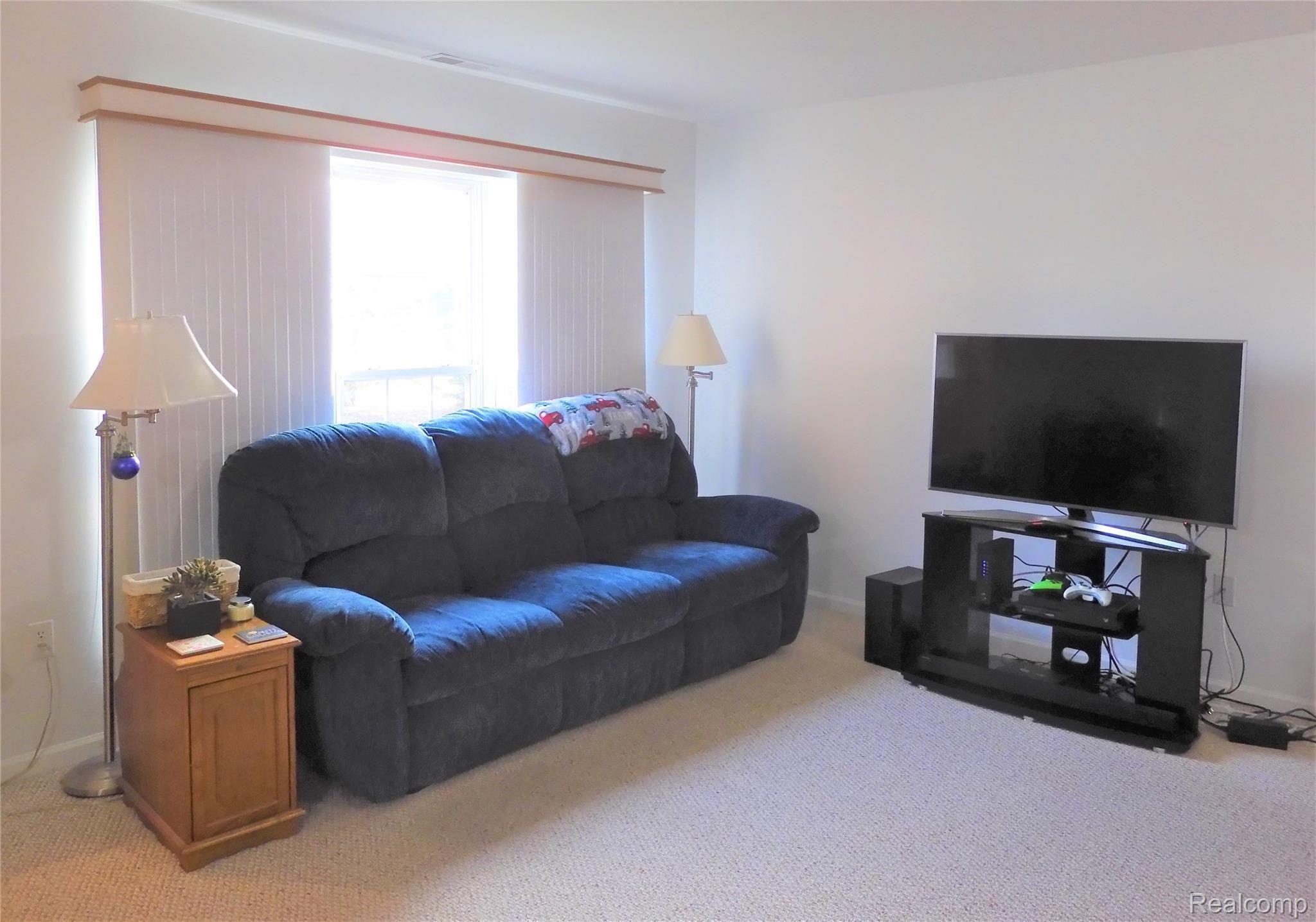 33480 Utica Road Fraser, MI 48026 - Photo 10 of 31 10 Living Room with Sofa and TV.JPG