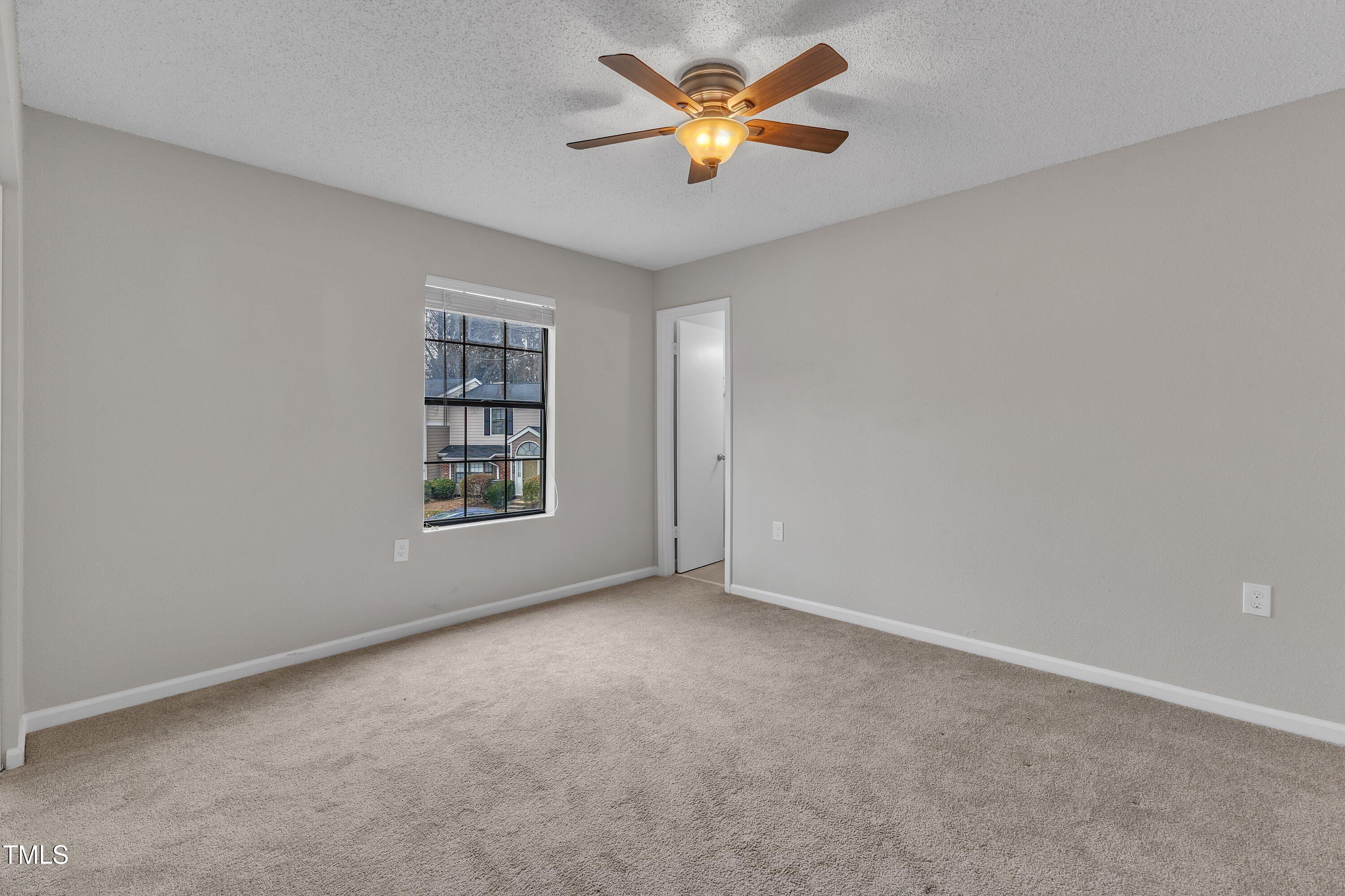 7811 Falcon Rest Circle Raleigh, NC 27615 - Photo 23 of 39 a view of an empty room with a window
