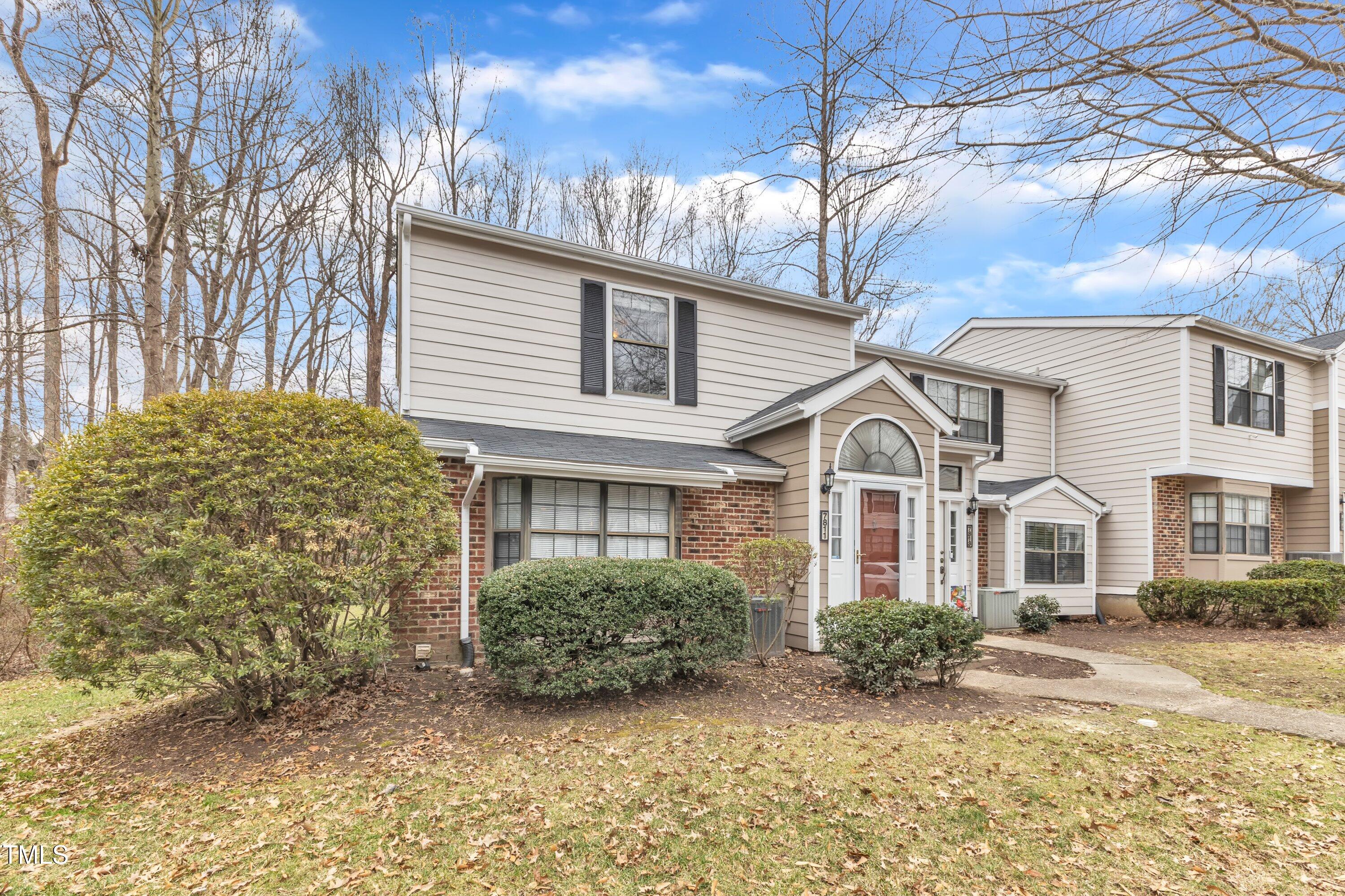 7811 Falcon Rest Circle Raleigh, NC 27615 - Photo 2 of 39 a front view of a house with garden