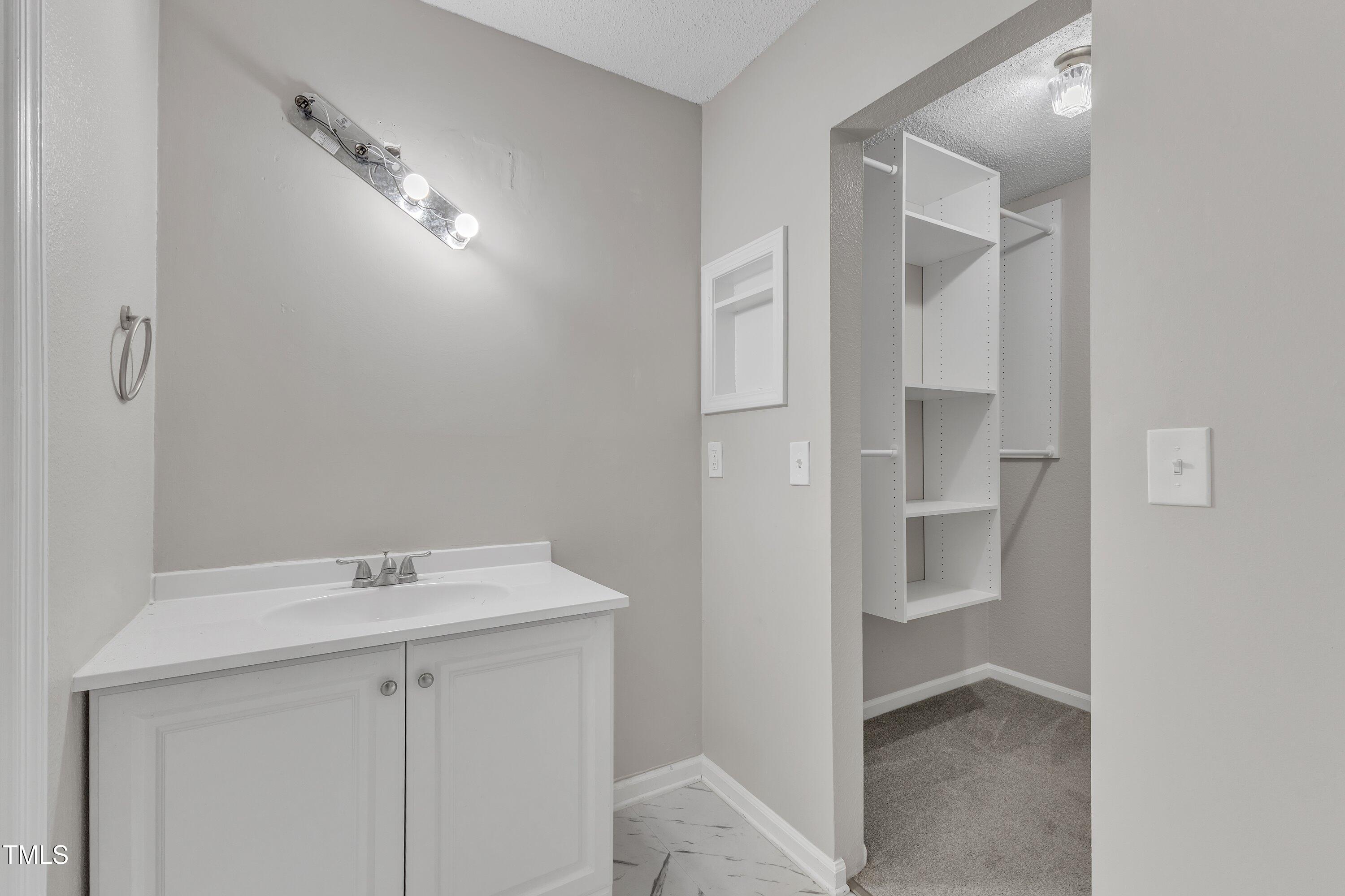 7811 Falcon Rest Circle Raleigh, NC 27615 - Photo 30 of 39 a view of a hallway with washer and dryer