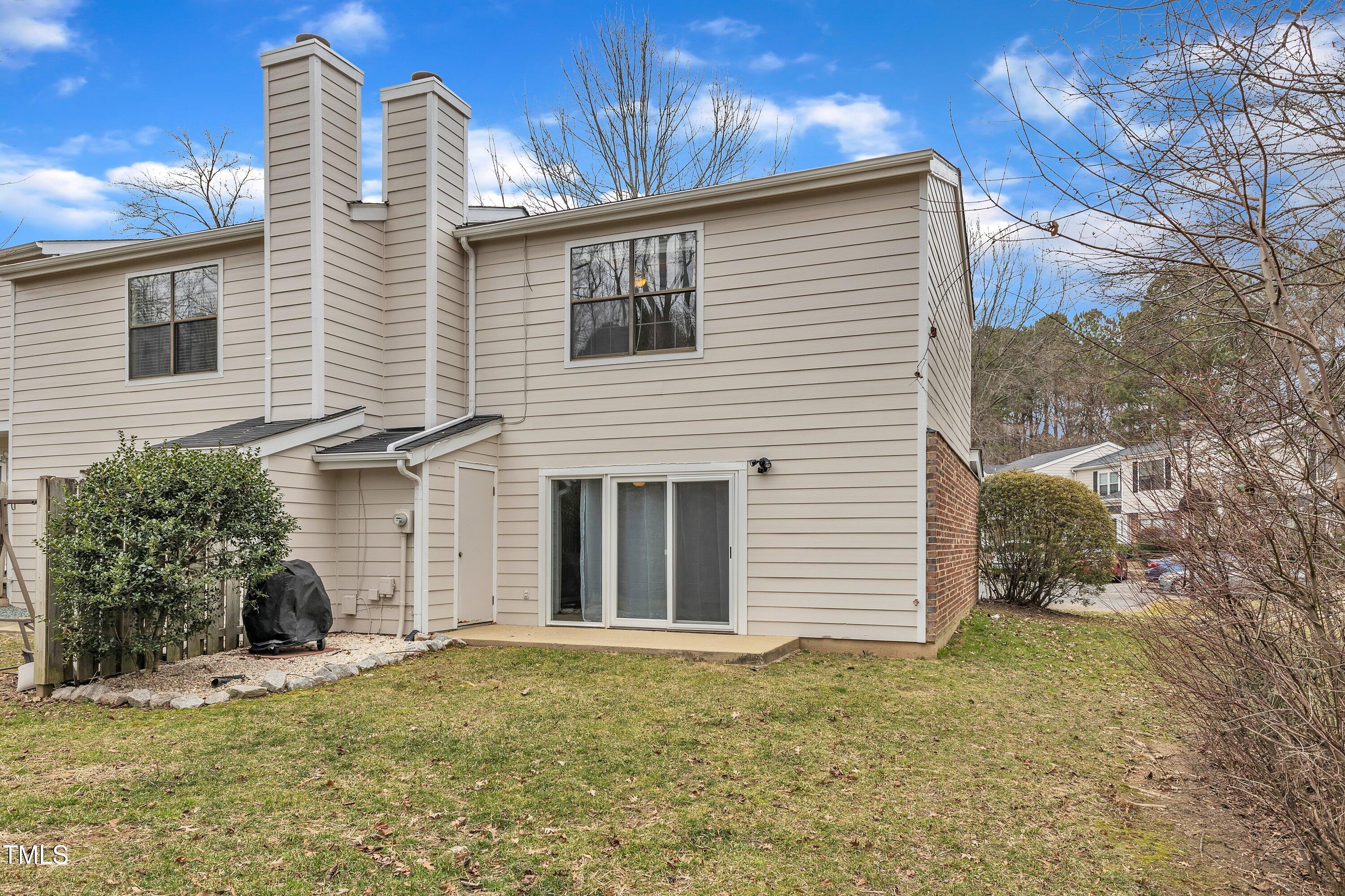 7811 Falcon Rest Circle Raleigh, NC 27615 - Photo 35 of 39 a front view of a house with a yard