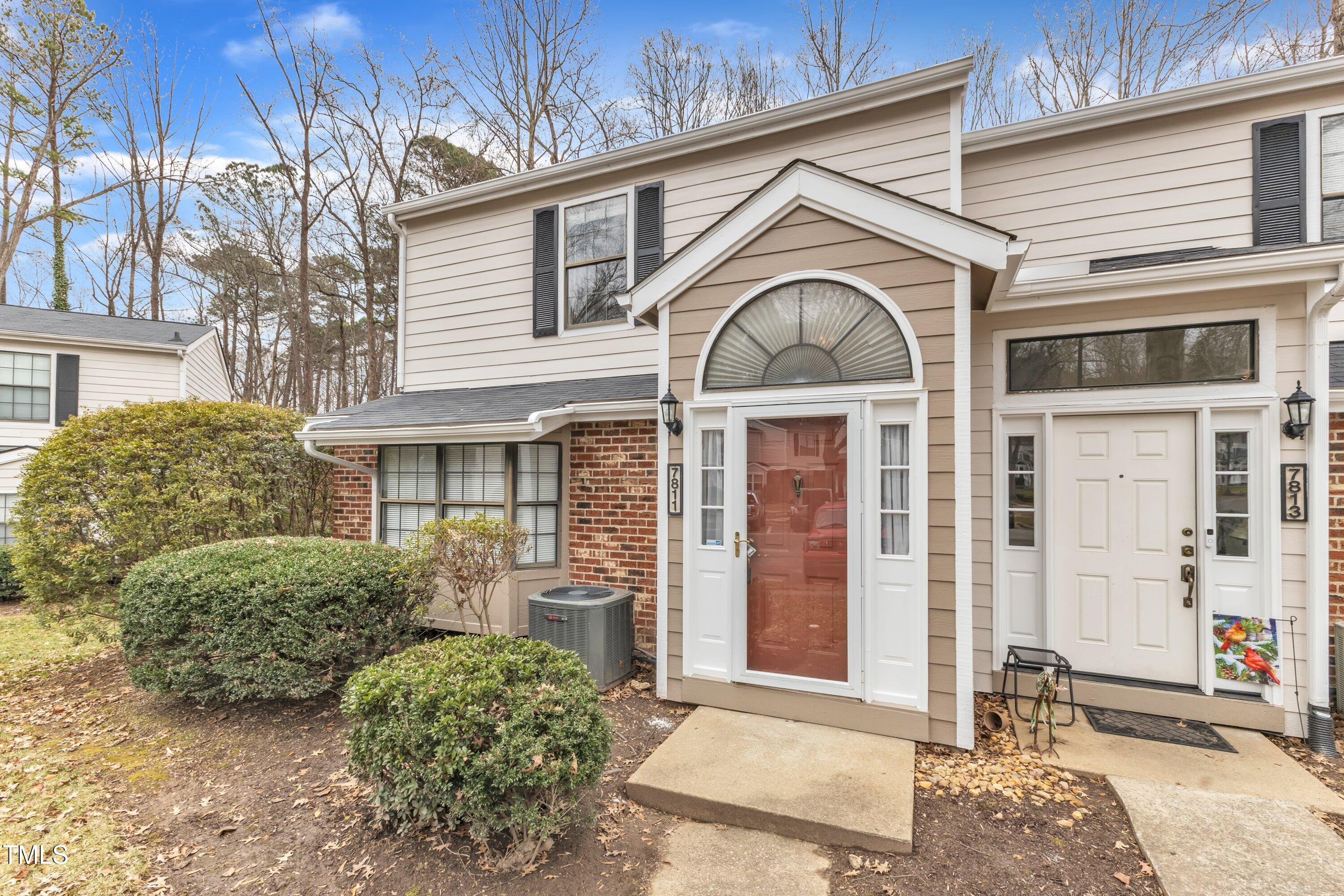 7811 Falcon Rest Circle Raleigh, NC 27615 - Photo 3 of 39 a front view of a house with garden