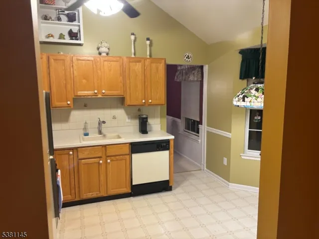 a spacious bathroom with a sink and a mirror
