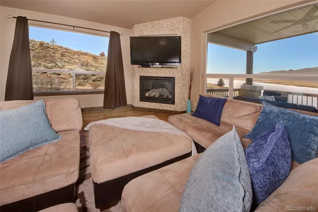 a spacious bedroom with two beds and a television