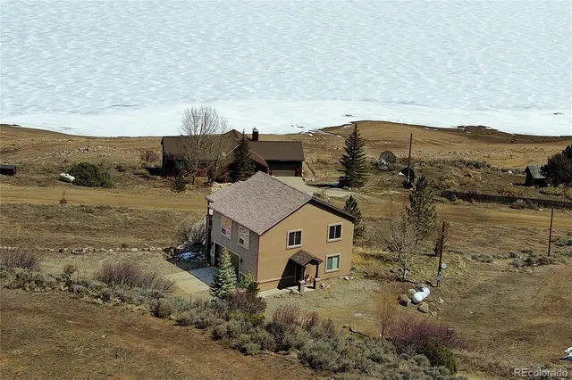 an aerial view of houses with outdoor space