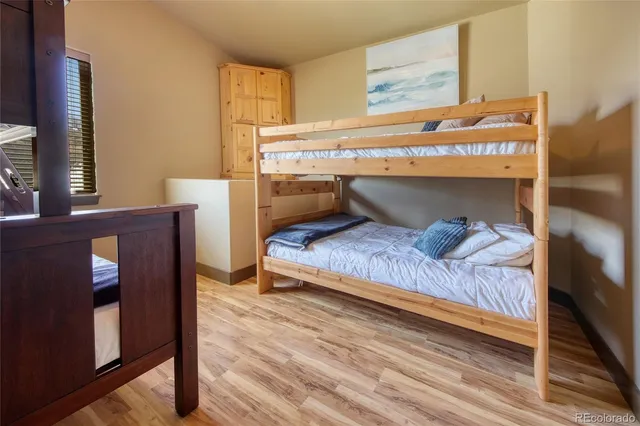 a living room with a couch and wooden floor