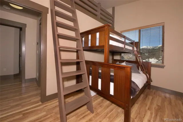 a bedroom with bunk beds and a window