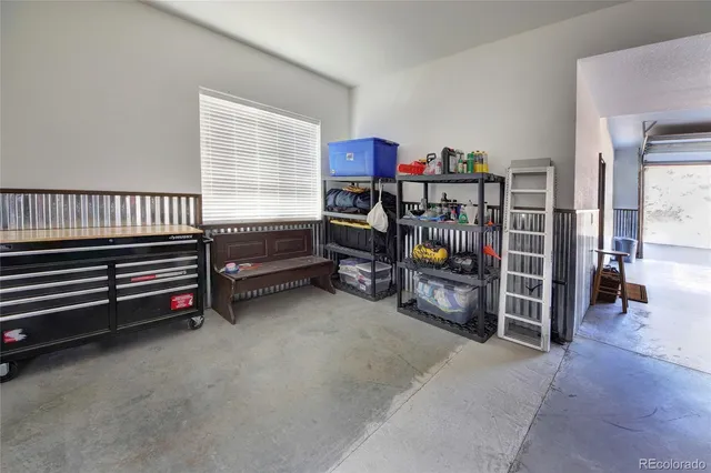 a view of a livingroom with furniture and a window