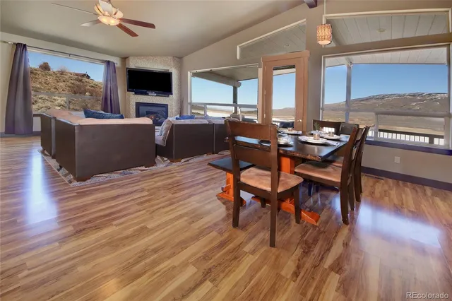 a view of a dining room with furniture window and wooden floor