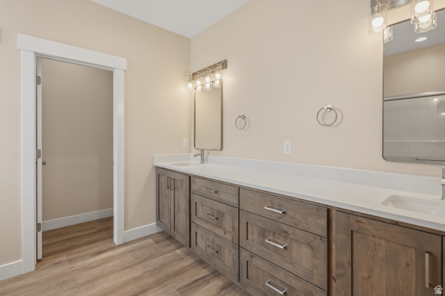 157 West 100 South Joseph, UT 84739 - Photo 15 of 30 Bathroom with double vanity and light wood-type flooring